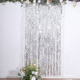 Add a Touch of Elegance to Your Event with the Metallic Silver Wavy Foil Fringe Party Backdrop
